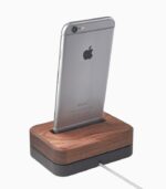 A wooden dock with an iphone on top of it.